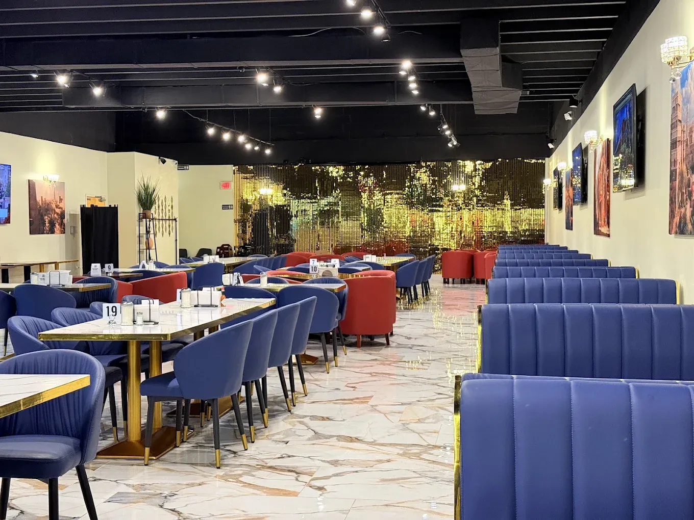 SimSim Restaurant elegant dining room with gold mosaic wall